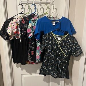 A Set Of 7 Scrub Shirts. Meduim